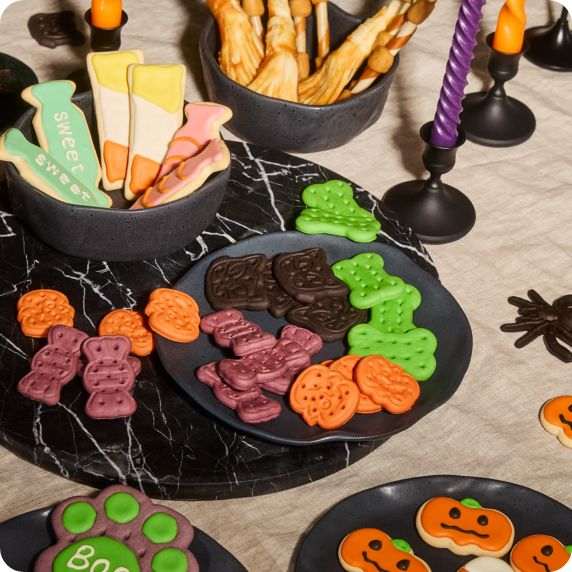 Variety of Halloween-themed baked treats for pets