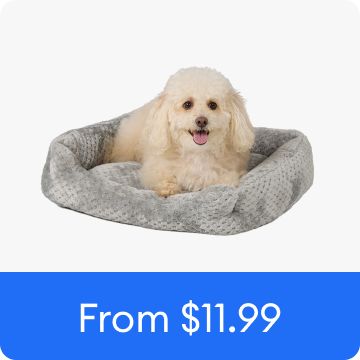 Dog laying on a cozy cuddler bed