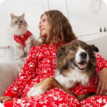 Cat, dog & woman in matching red outfits