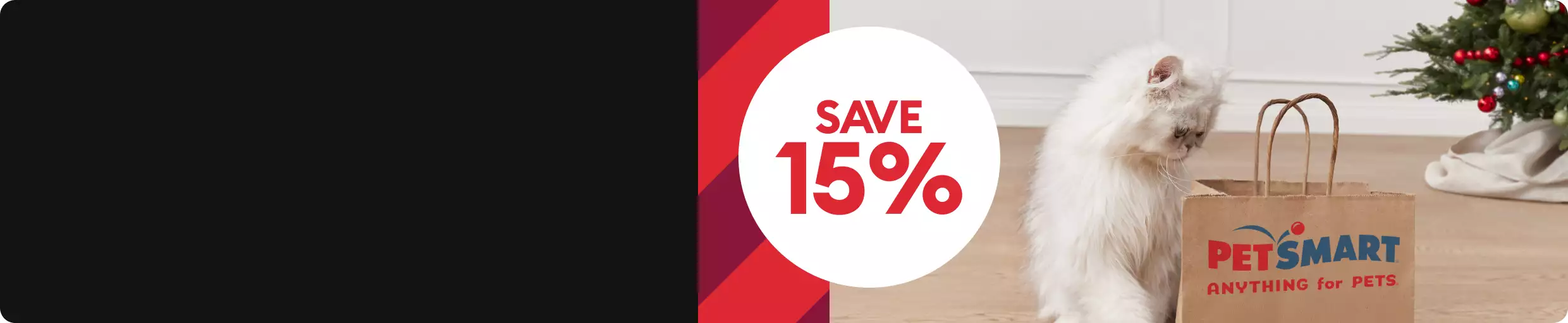 SAVE 15% with cat peering into PetSmart shopping bag