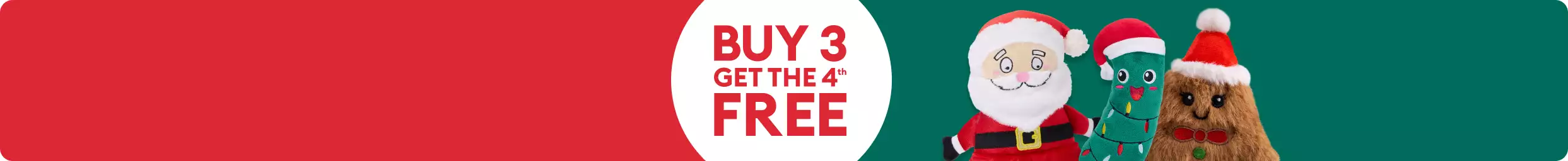 Various holiday dog toys including a Christmas pickle and Santa on a green background