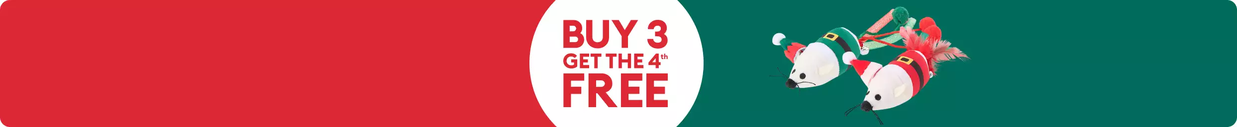 Various holiday dog toys including a Christmas pickle and Santa on a green background