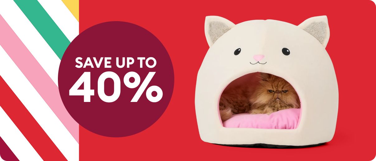 A cat hut bed on a red background beside a circle that says “Save up to 40%,” with colorful diagonal stripes along the left side