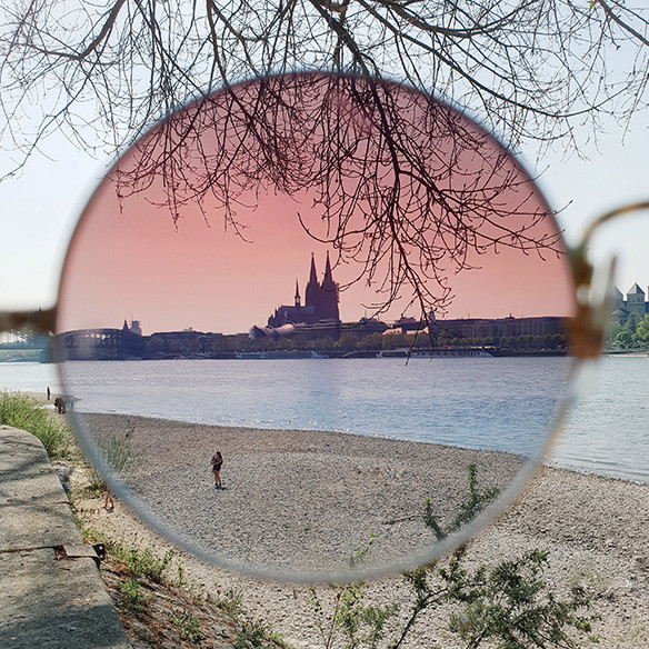 A photo captured with Galaxy by Instagram user @lulovas of a landscape seen through a rose-colored sunglass lens