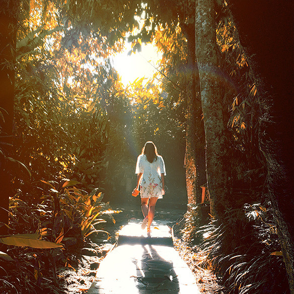 A photo captured with Galaxy by Instagram user @morpeous of a woman walking into a sunny tree-filled area