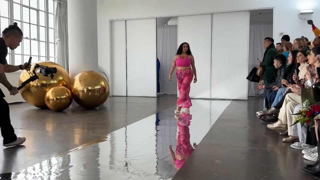 Designer Kimberly Beasley told NY1 that if not for Flying Solo, she would not be able to participate in New York Fashion Week. (Spectrum News NY1)