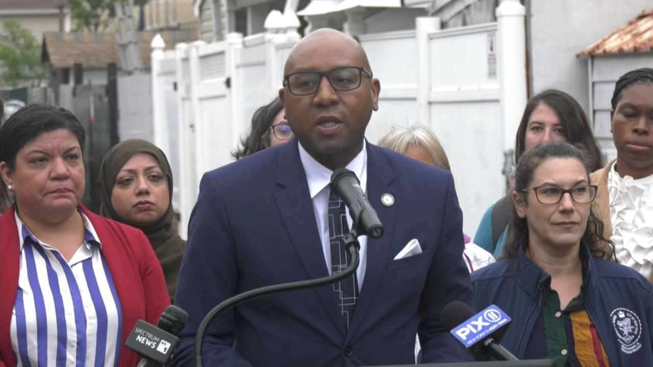 Queens leaders and local residents of East Elmhurst gathered in an alleyway that was flooded after Hurricane Ida to demand the Trump administration to restore federal funding for projects to prevent flooding in the borough. (Spectrum News NY1)