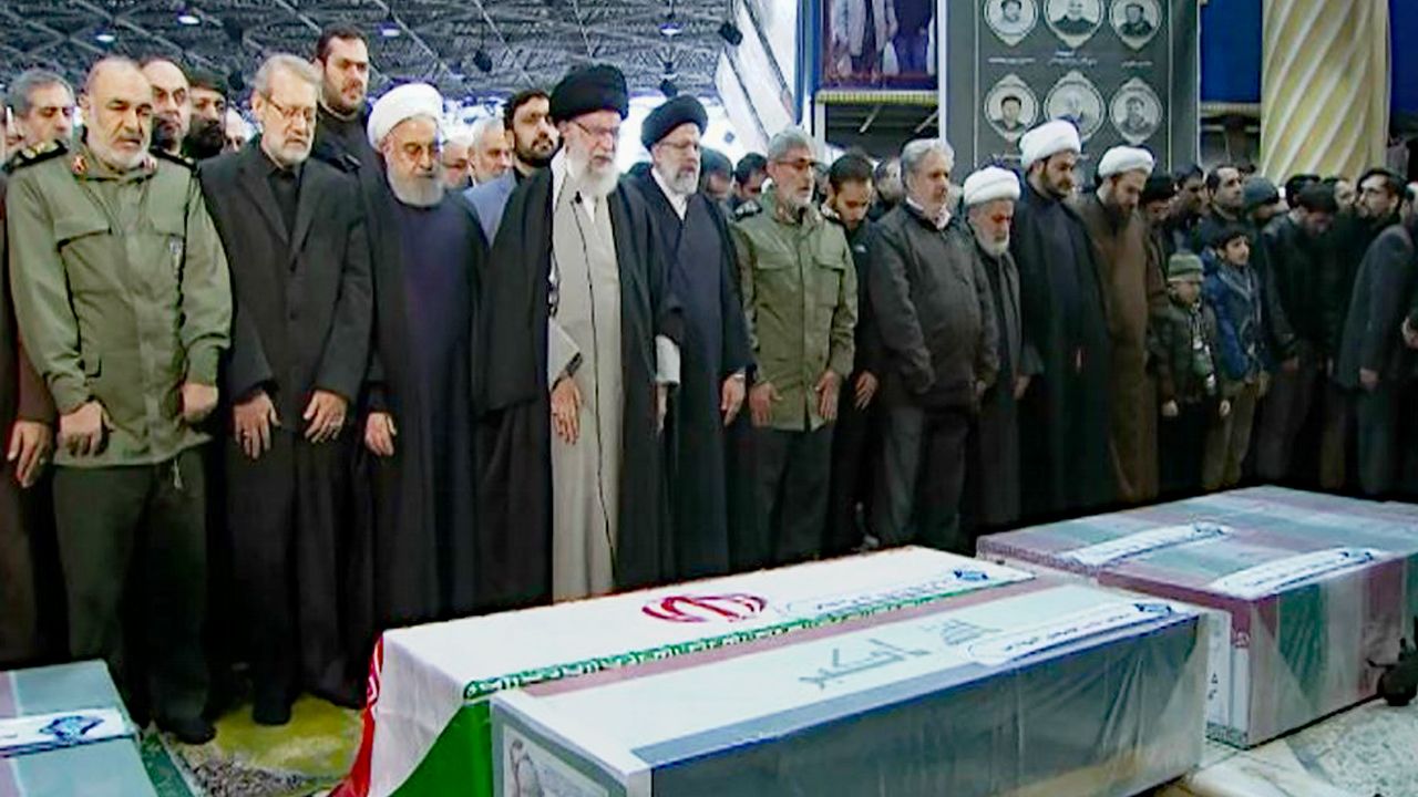 In this photo released by the official website of the Office of the Iranian Supreme Leader, supreme leader Ayatollah Ali Khamenei, fourth from left, leads a prayer over the coffins of Gen. Qassem Soleimani and his comrades, who were killed in Iraq in a U.S. drone strike on Friday, at the Tehran University campus, in Tehran, Iran, Monday, Jan. 6, 2020. (Office of the Iranian Supreme Leader via AP)