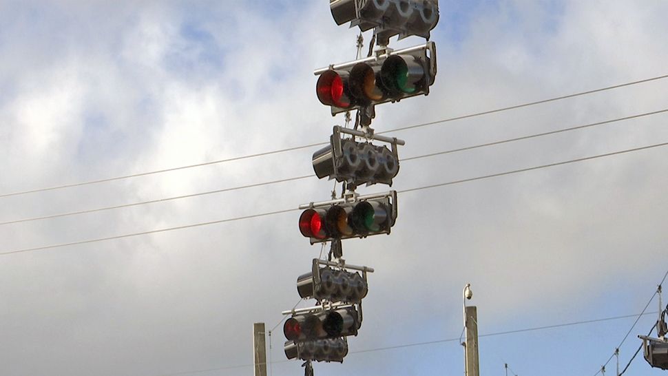 The city of Orlando says that FDOT replaced the overhead cabling within the last two months, a design that is used nationwide. However, some residents complain that the traffic lights at the intersection go out when a storm hits. (Ryan Harper/Spectrum News 13)