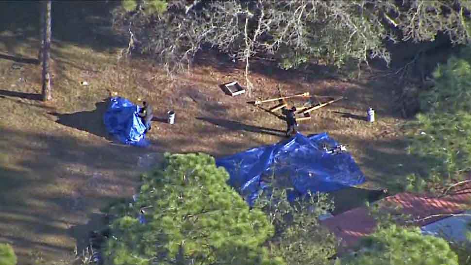 Authorities on scene the property of a home on SW 47th Street in Marion County, where possible human remains were discovered Thursday, Jan. 10, 2019. (Sky 13)