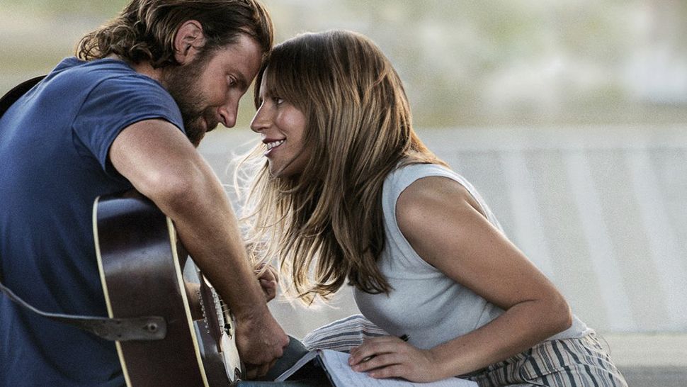 This file image released by Warner Bros. Pictures shows Bradley Cooper, left, and Lady Gaga in a scene from "A Star is Born."  (AP file photo)