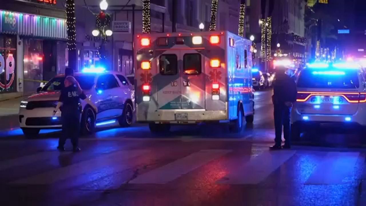 An ambulance heads for a New Orleans hospital following the attack on Bourbon street.