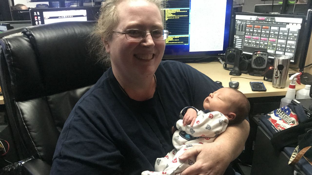 Brevard County Fire 911 dispatcher Karen Holley meets Taylor on Wednesday, a week after Taylor came into the world on Interstate 95 on the way to the hospital. (Greg Pallone/Spectrum News)