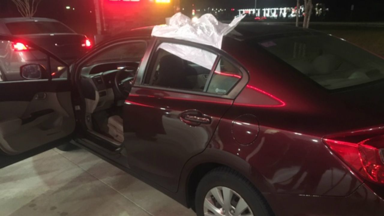 This car in Deltona was one of several damaged by what Volusia County investigators say was shots from a BB, pellet, or small-caliber gun. Several agencies are investigating. (Matt Fernandez/Spectrum News 13)