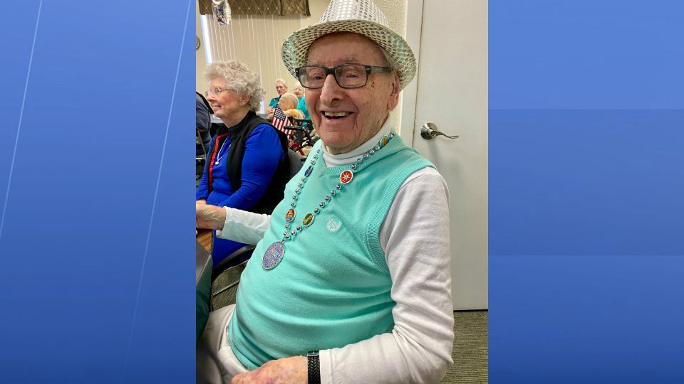 Ike Newcomer chatted with friends Thursday and even danced with his daughter, Patty Johnson, which was quite the treat for him considering he used to square dance in his younger years. (Stephanie Claytor/Spectrum News)