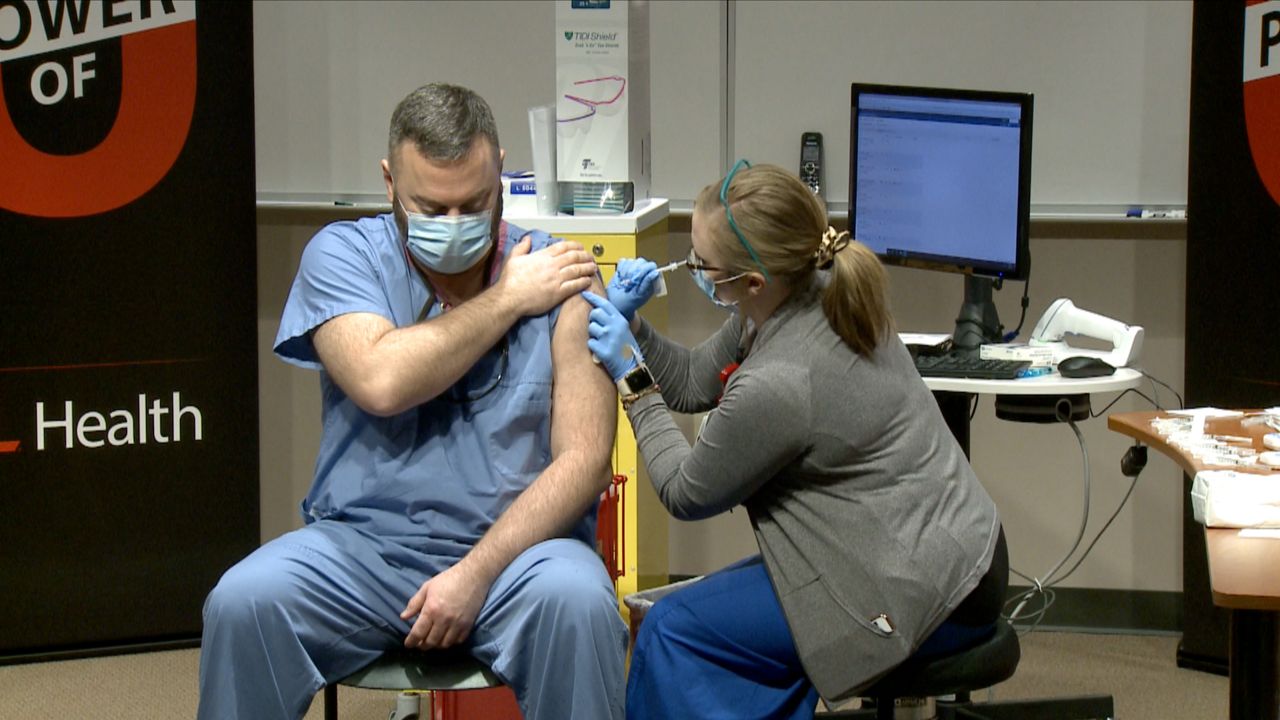 Dr. Jason Smith got the first dose of vaccine at UofL Hospital, in December. 