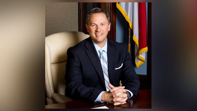 Lt. Gov. Dan Forest poses at a desk