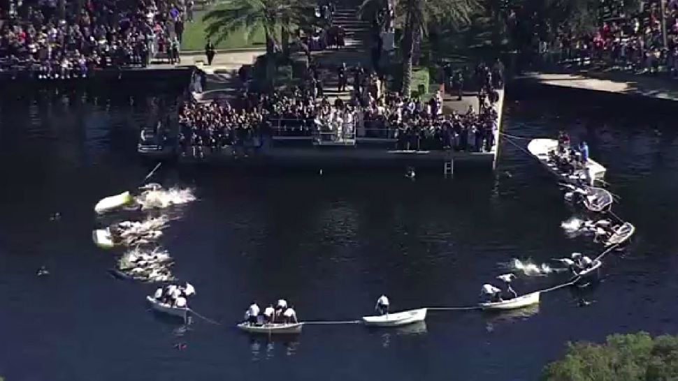 Dozens of teen boys make the plunge into Spring Bayou on Sunday afternoon to find a traditional cross tossed into the water by an archbishop. The 113th annual event celebrates Epiphany and is the biggest event of its kind in the Western Hemisphere. (Spectrum News)