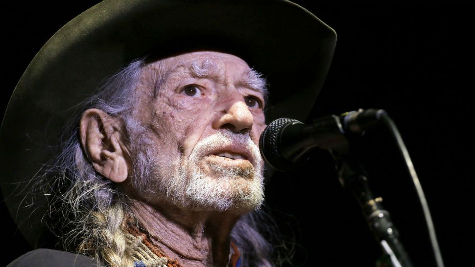 FILE - In this Jan. 7, 2017, file photo, Willie Nelson performs in Nashville, Tenn. Organizers of the “Harvey Can’t Mess With Texas” benefit concert announced on Wednesday, Sept. 13, that Nelson, Bonnie Raitt, Paul Simon and James Taylor are among the stars headlining the four-hour show scheduled for Sept. 22 in Austin that will raise money for victims of Hurricane Harvey. (AP Photo/Mark Humphrey, File)
