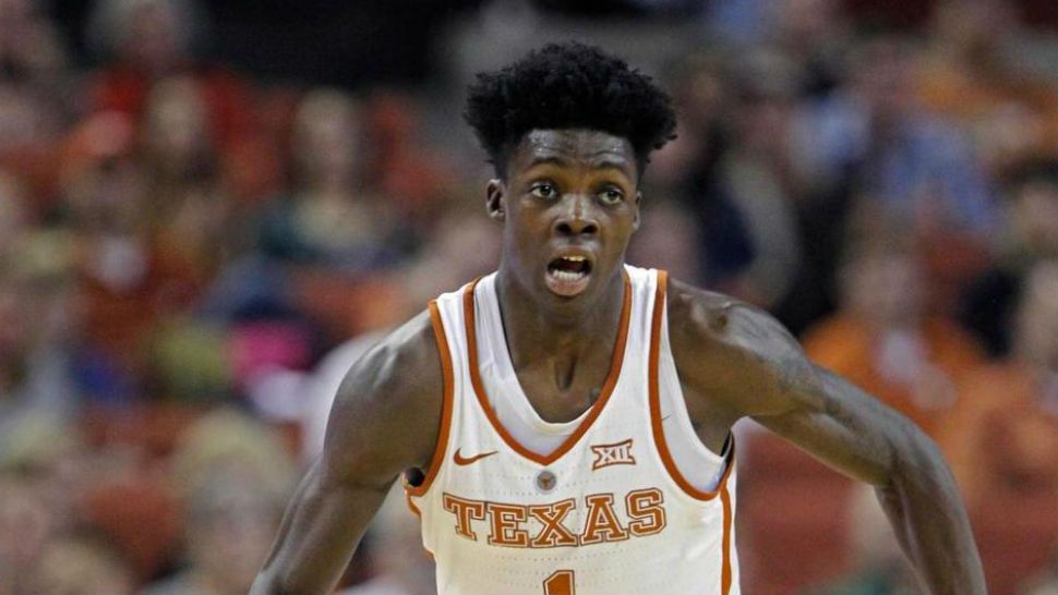 FILE - In this March 4, 2017, file photo, Texas guard Andrew Jones dribbles the ball during the second half of an NCAA college basketball game against Baylor, in Austin, Texas. Texas announced, Wednesday, Jan. 10, 2018, that sophomore guard Andrew Jones has leukemia and has started treatment. Jones was the Longhorns leading scorer before he was sidelined by a broken wrist. He played sparingly in his return after complaining of low energy and was sent for tests. (AP Photo/Michael Thomas, File)