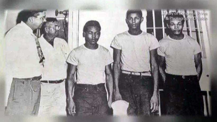Sheriff Willis McCall with three of the "Groveland Four" next to him. (Spectrum News image)