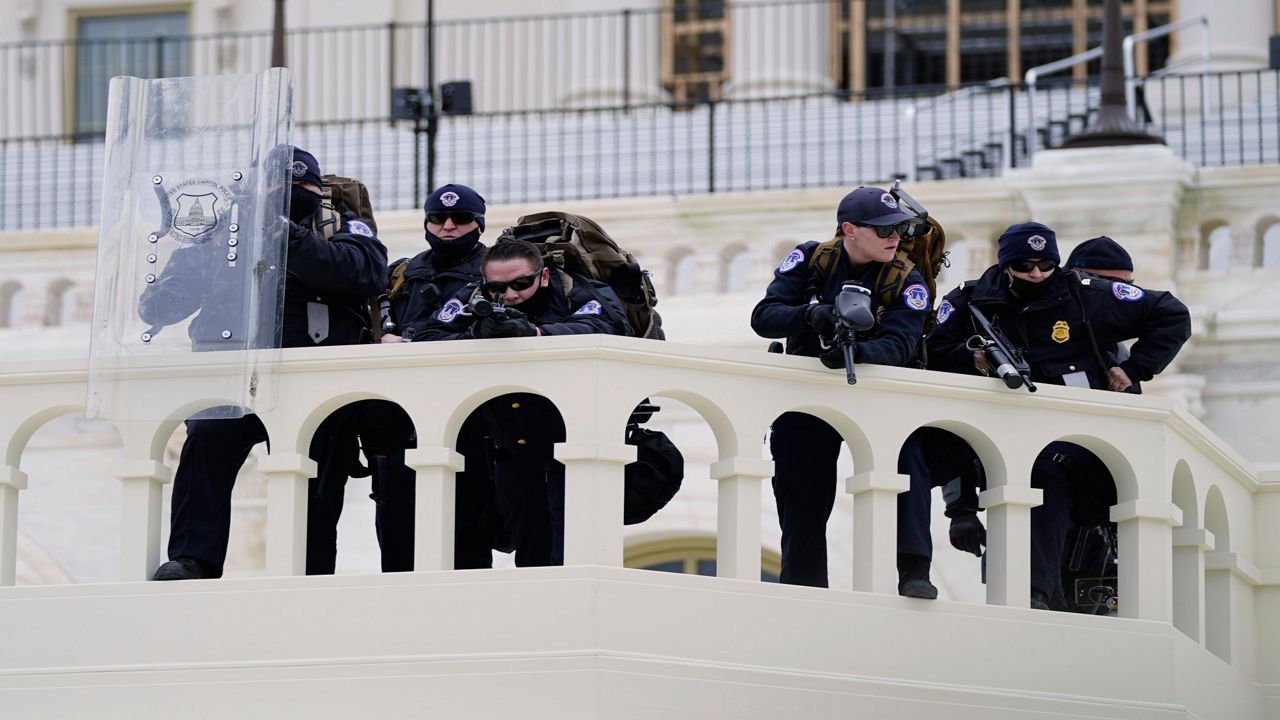 Police officers on a balcony