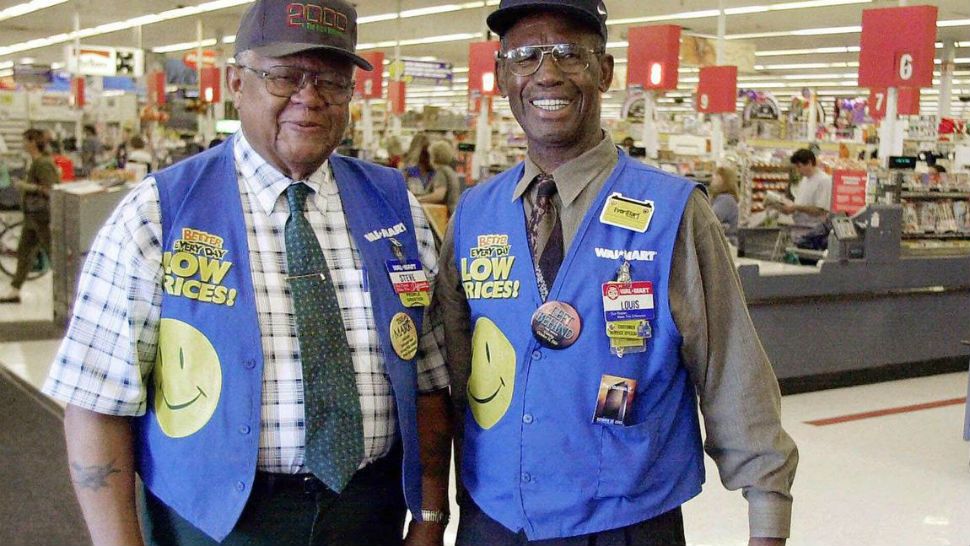 Walmart greeters in Tampa, Fla., pose in this 2000 file photo. (CHRIS O'MEARA / Associated Press)