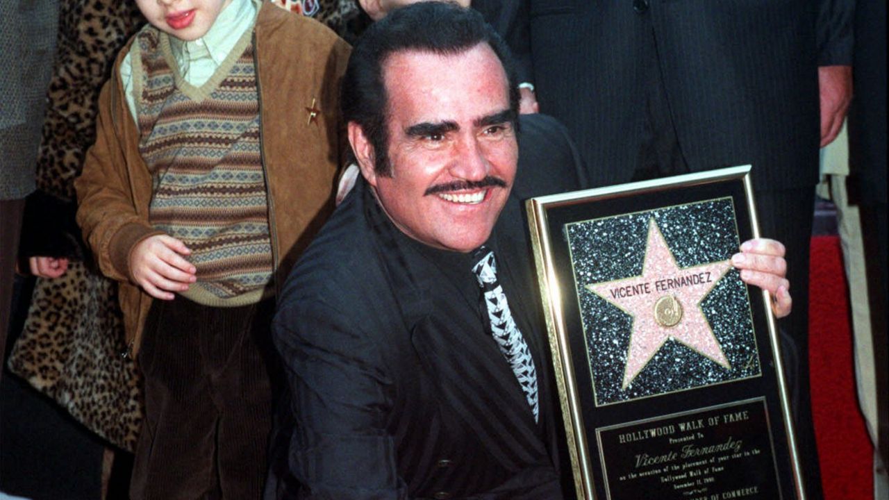 Vicente Fernández, the Ranchera star known as the "King of Mexican Music," touches his new star on the Hollywood Walk of Fame during dedication ceremonies Wednesday, Nov. 11, 1998, in Los Angeles. (AP Photo/Nick Ut)