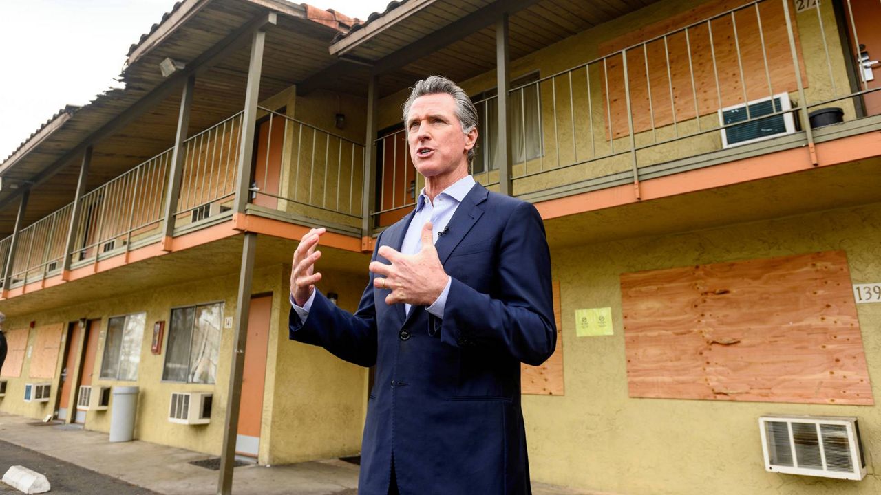 California Governor Gavin Newsom speaks with reporters while touring Bella Vista Inn on Jan. 13, 2022, in Santa Clara, Calif. (AP Photo/Noah Berger)