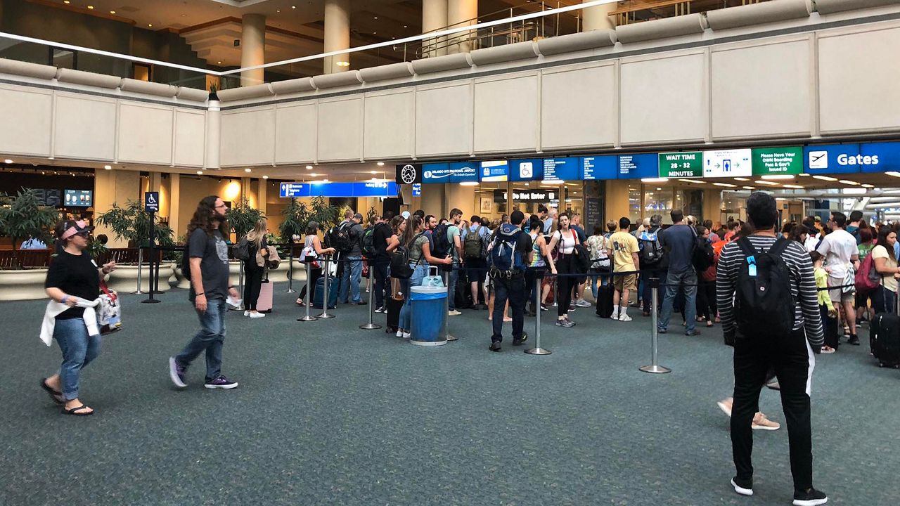 Travelers at Orlando International Airport. (Spectrum News 13 file)