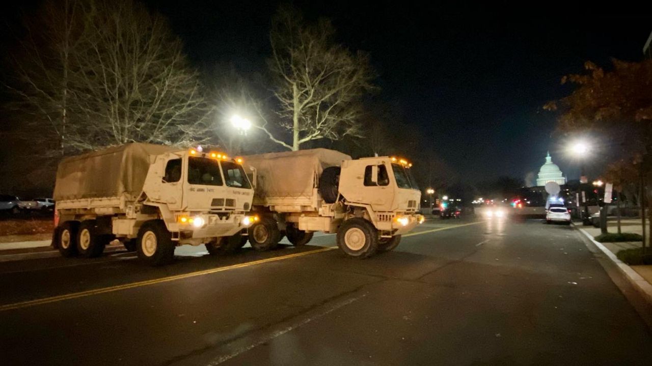 Military vehicles block a road near Capitol Hill in Washington on Wednesday, January 13, 2021. (Taylor Popielarz/Spectrum News)