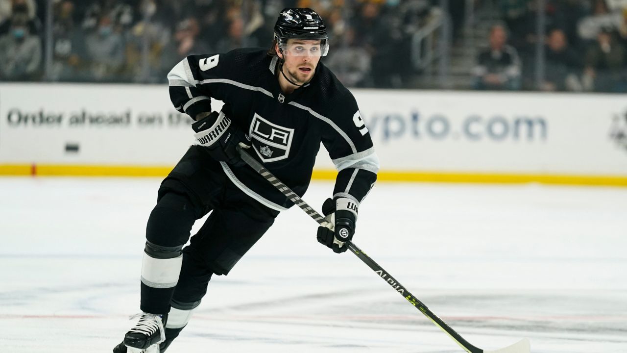 Los Angeles Kings' Adrian Kempe goes after the puck during the second period of an NHL hockey game against the Pittsburgh Penguins Thursday, Jan. 13, 2022, in Los Angeles. (AP Photo/Jae C. Hong)
