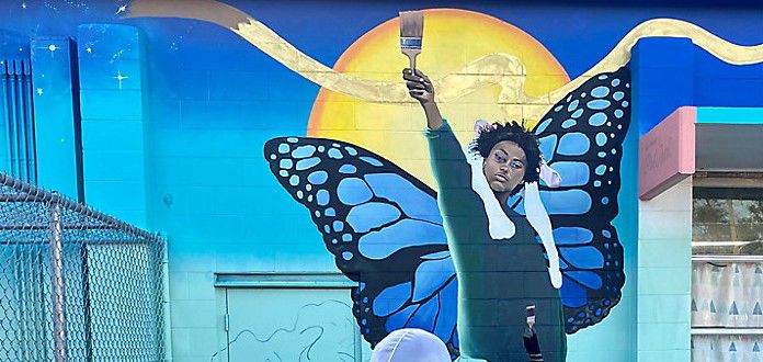 Nine students from Parramore participated in a free art program facilitated by ArtReach Orlando. The kids served as inspiration for the mural located along Arlington Street.