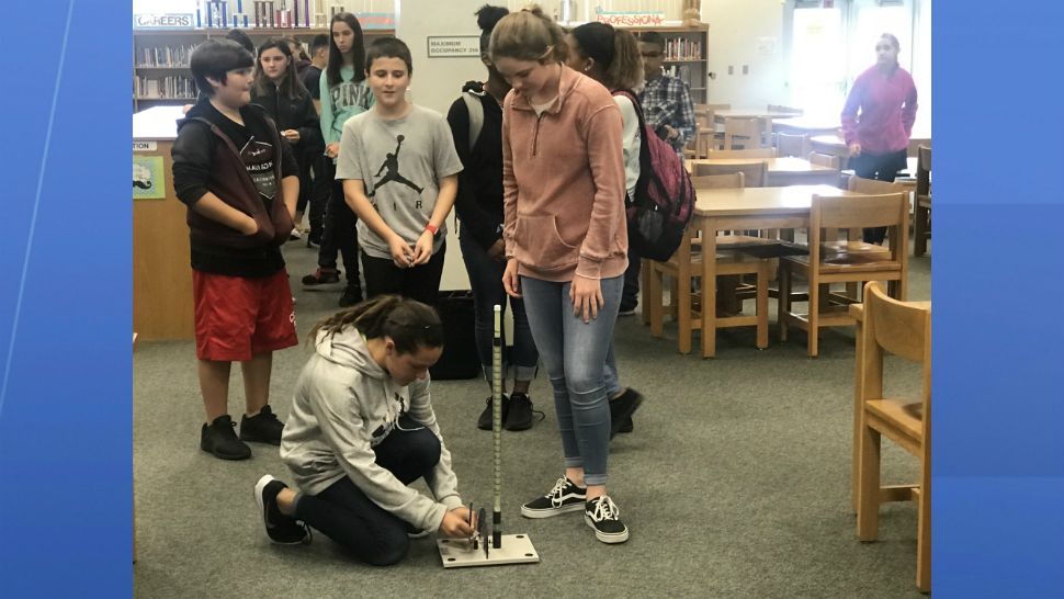 Students at Central Middle School in West Melbourne on Wednesday learned how to make tiny "rockets" out of ordinary household items. (Greg Pallone/Spectrum News 13)