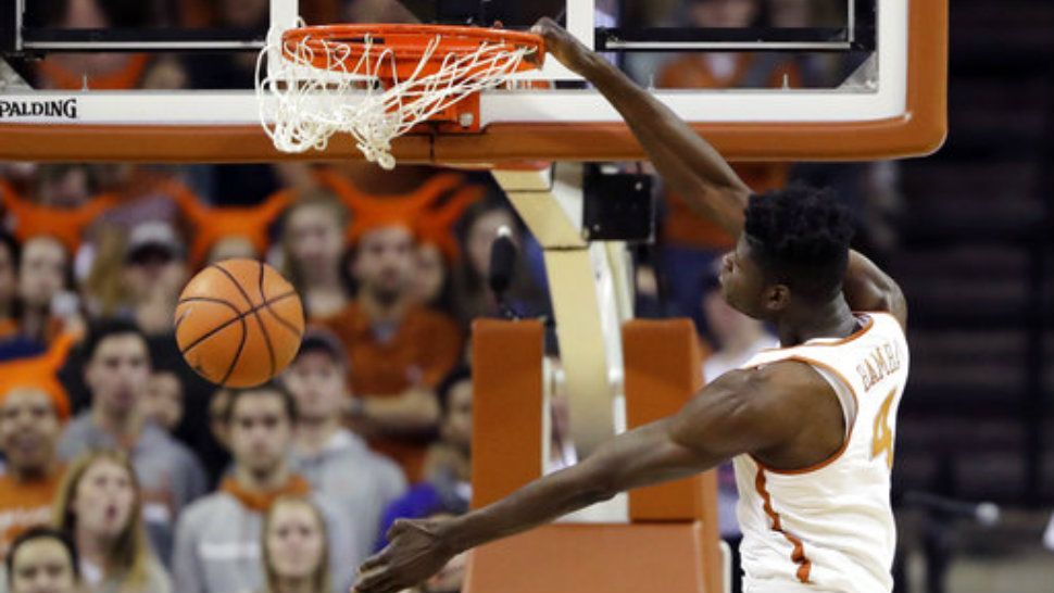 Texas forward Mohamed Bamba (4) slam dunks the ball to score against Texas Tech during the first half of an NCAA college basketball game, Wednesday, Jan. 17, 2018, in Austin, Texas. (AP Photo/Eric Gay)