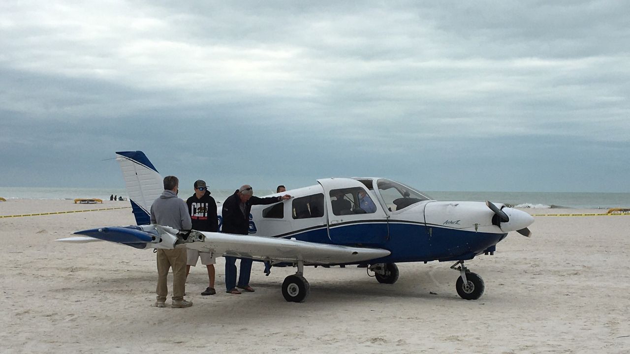 The right wing of a small plane was damaged when the aircraft's engine quit and it had to be landed on a Treasure Island beach. No one was injured. (Quintin Wynn/Spectrum News)