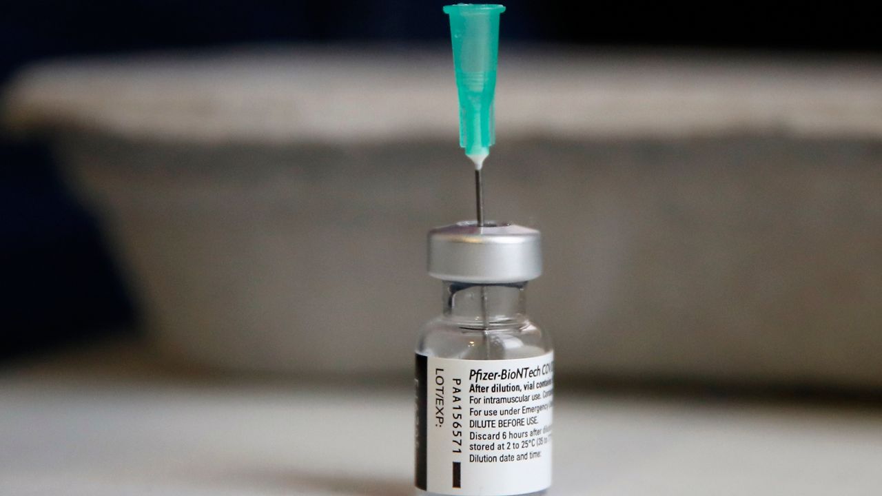 A Jan. 18, 2021, file photo of a vial containing the Pfizer COVID-19 vaccine
