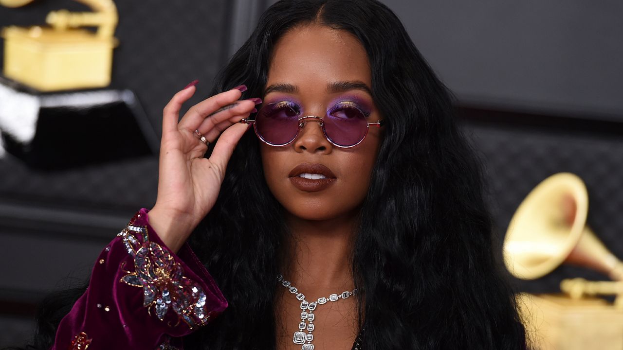 H.E.R. arrives at the 63rd annual Grammy Awards at the Los Angeles Convention Center on Sunday, March 14, 2021. (Photo by Jordan Strauss/Invision/AP)
