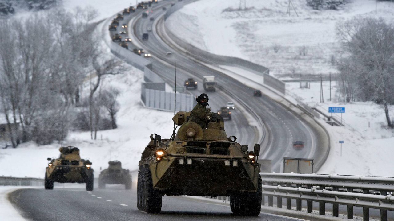 A convoy of Russian armored vehicles moves along a highway in Crimea, Tuesday, Jan. 18, 2022. (AP Photo, File)