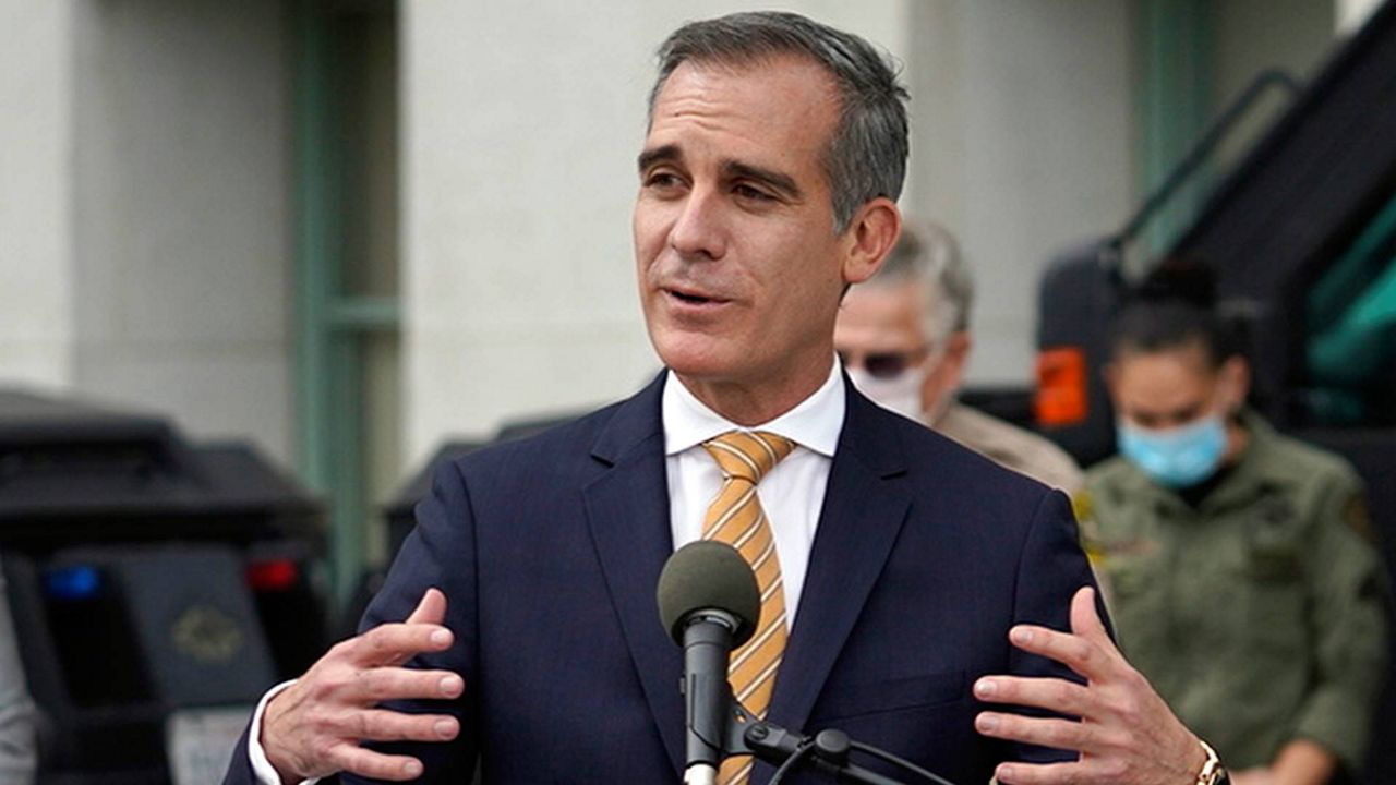 Los Angeles Mayor Eric Garcetti speaks at news conference outside the Hall of Justice in LA, on Jan. 19, 2021. (AP Photo/Damian Dovarganes, File)