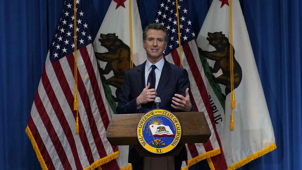 California Gov. Gavin Newsom outlines his 2021-2022 state budget proposal during a news conference in Sacramento, Calif., Friday, Jan. 8, 2021. (AP Photo/Rich Pedroncelli, Pool)