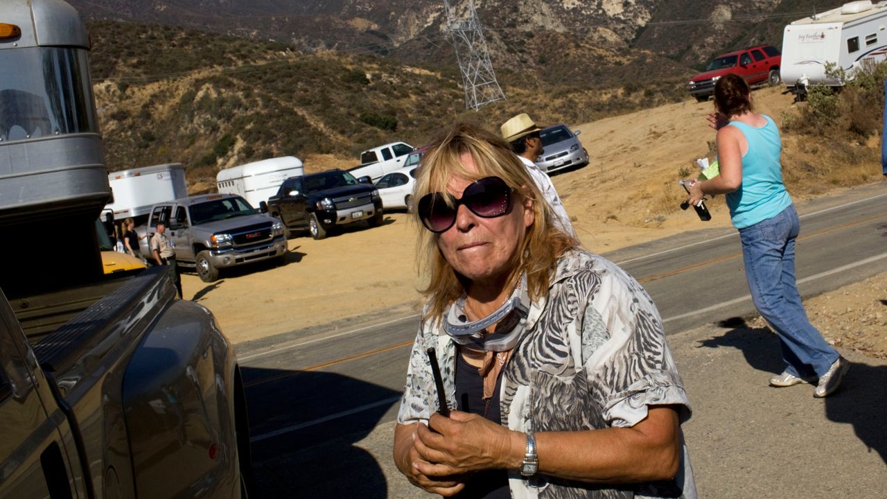 Wildlife Waystation founder Martine Colette pauses while directing efforts to evacuate animals at the 160 acre facility in Angeles National Forest Monday, Aug. 31, 2009. (AP Photo/ Philip Scott Andrews)