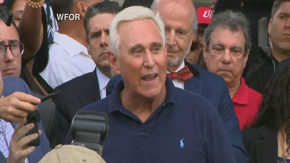 Roger Stone speaks to the crowd outside the federal courthouse in Fort Lauderdale Friday, January 25. (Spectrum News)