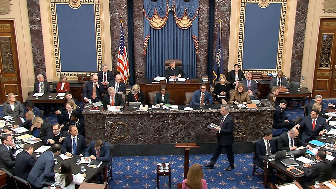 In this image from video, White House counsel Pat Cipollone walks to the podium to begin the presentation of the case by the defense during the impeachment trial against President Donald Trump in the Senate at the U.S. Capitol in Washington, Saturday, Jan. 25, 2020. (Senate Television via AP)