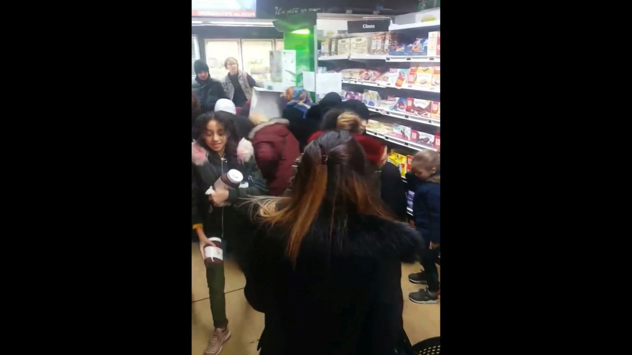 In this image taken from video a customer carries away pots of Nutella the chocolate and hazelnut spread, as others congregate around display of the product in a supermarket in Toulon southern France on Thursday Jan. 25, 2018. Brawls broke out in French supermarkets on Thursday as shoppers scrambled to get their hands on discounted pots of the chocolate and hazelnut spread Nutella. (AP Photo)