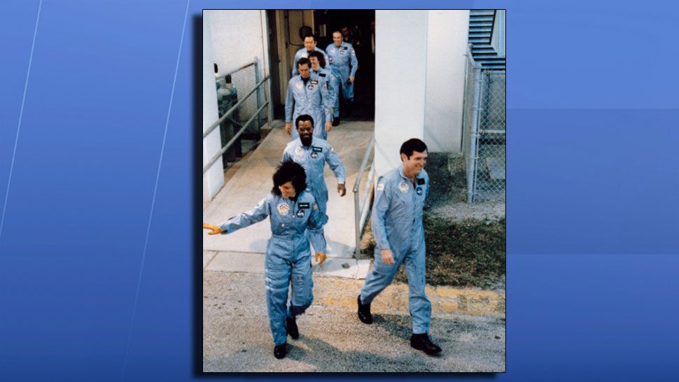The Challenger crew walks out on their way to the launch pad at Kennedy Space Center. (NASA)