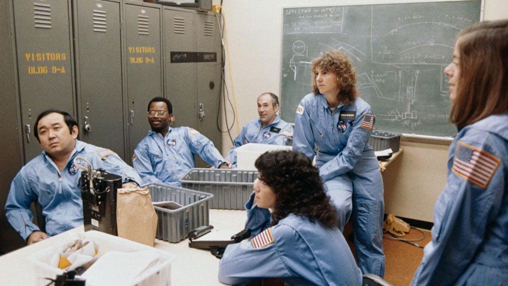 The Challenger crew is debriefed during training. (NASA)