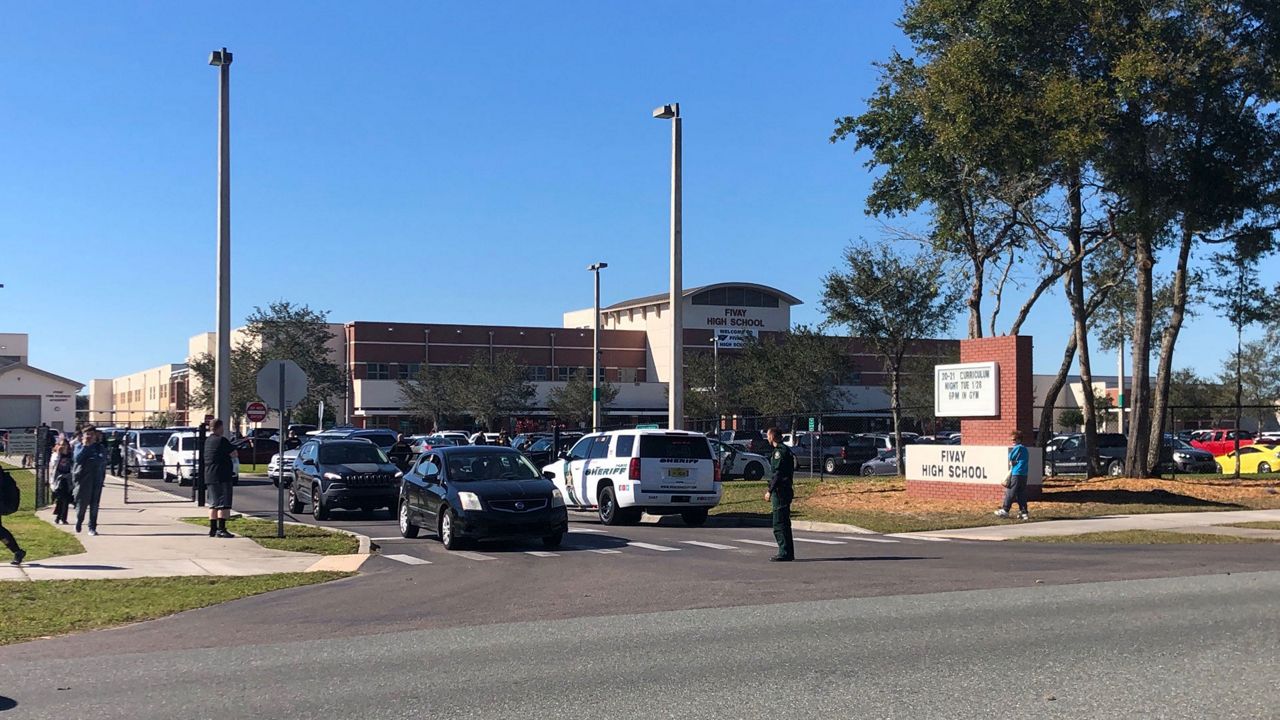 Pasco Sheriff's Office personnel outside Fivay High School in Hudson during a "controlled dismissal" Tuesday, January 28, 2020. (Tim Wronka/Spectrum Bay News 9)
