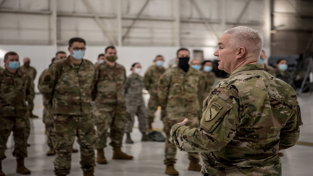 Brig. Gen. Hal Lamberton, adjutant general for the Commonwealth of Kentucky, speaks to a group of Soldiers and Airmen from the Kentucky National Guard at the Kentucky Air National Guard Base in Louisville, Ky., on Jan. 14, 2021. The Guardsmen are deploying this weekend to support the Presidential Inauguration at the nation’s capital Jan. 20. (U.S. Air National Guard photo by Staff Sgt. Joshua Horton)