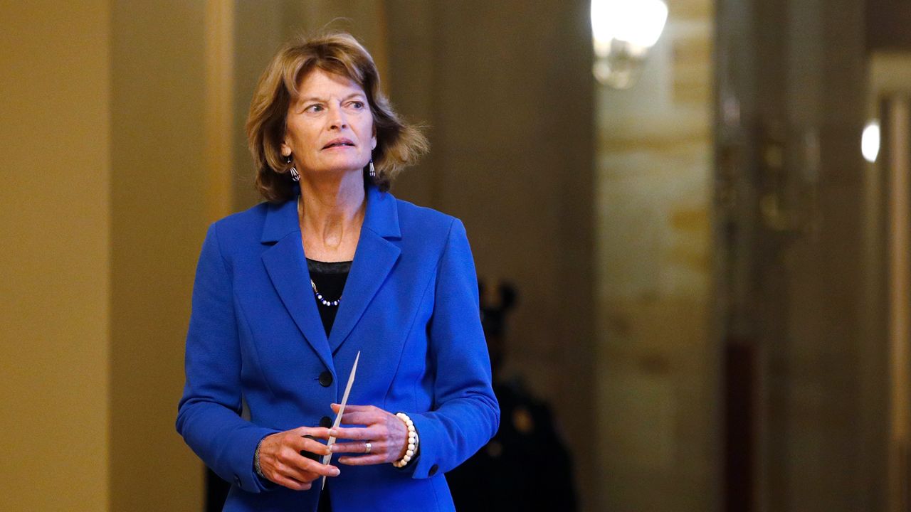 Republican Alaska Sen. Lisa Murkowski, wearing a blue blazer and a black blouse, outside the Senate chamber at the U.S. Capitol in Washington.